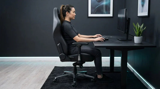 Side-view of a gamer in an ergonomic gaming chair, feet flat and upright posture — lumbar support for long sessions